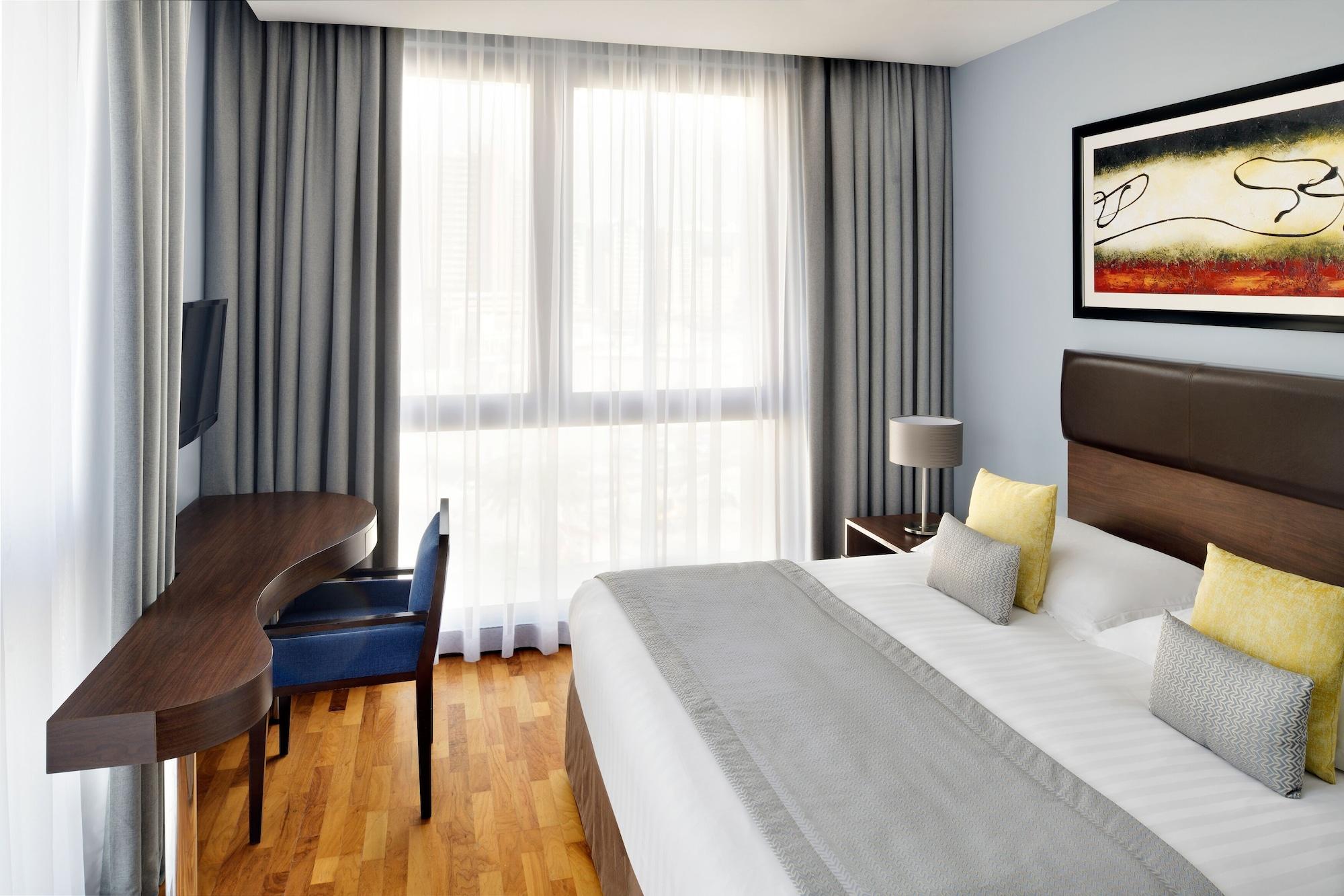 Moevenpick Hotel Apartments Al Mamzar Dubai Exterior foto A typical room at the hotel