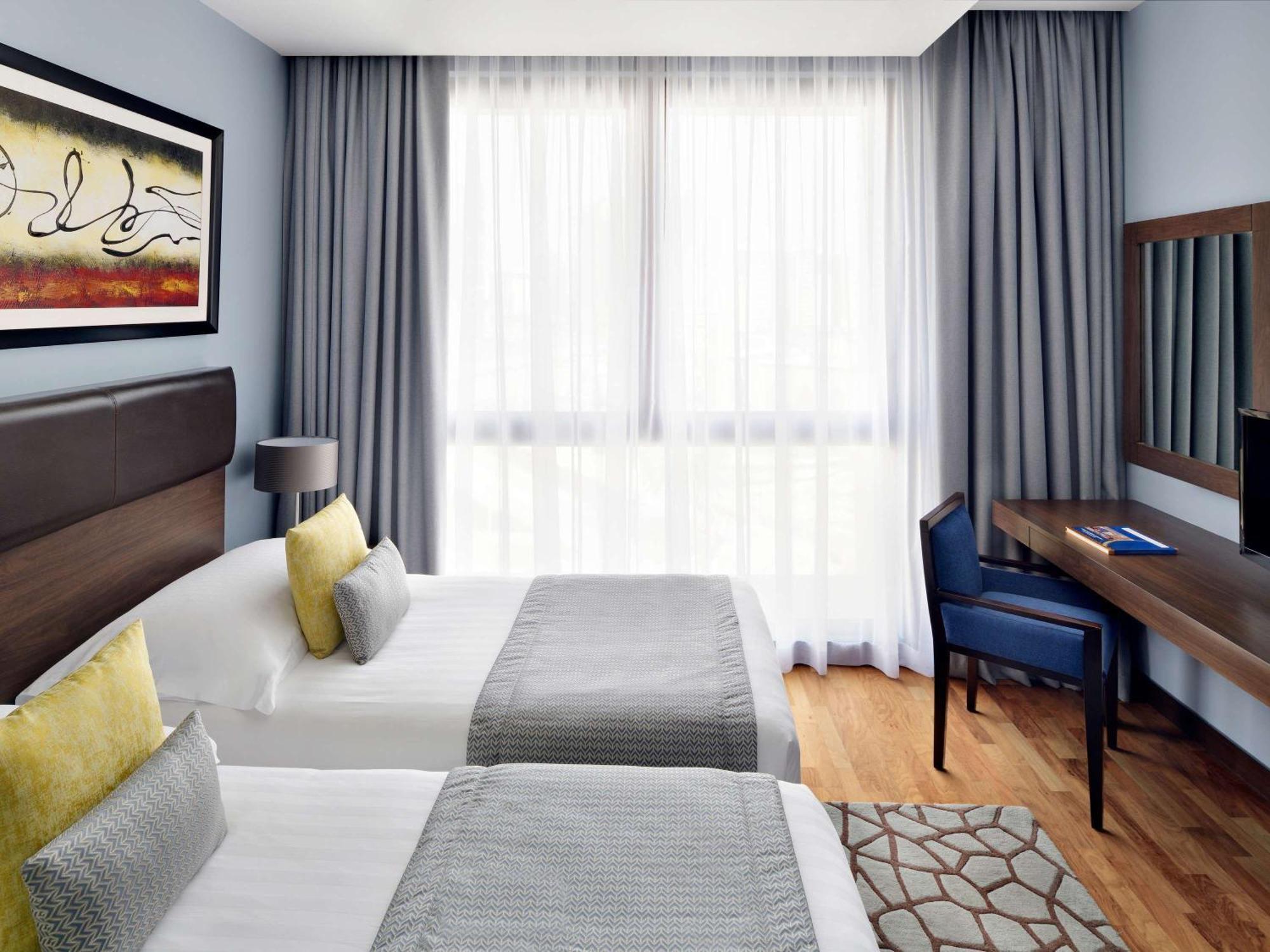 Moevenpick Hotel Apartments Al Mamzar Dubai Exterior foto A room at the hotel